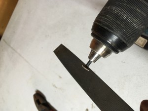 Filing the rough ground nail clean